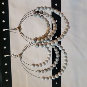 Earrings, white beads with black marbling. Silver tone wire